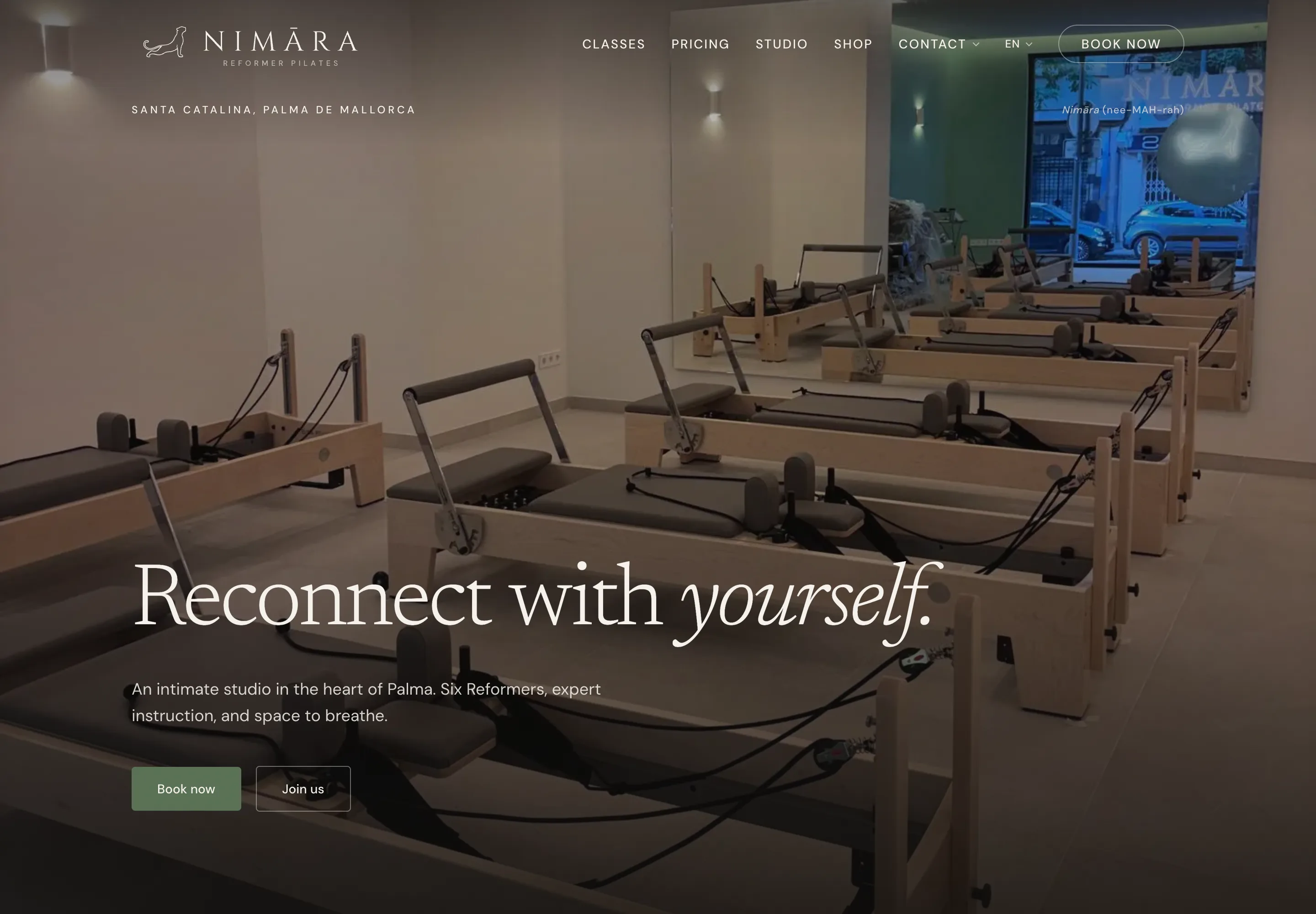 The Nimāra homepage, with the lockup in the header over a photograph of the studio